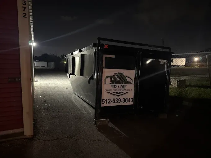 Roll off dumpster placed at a commercial storage facility