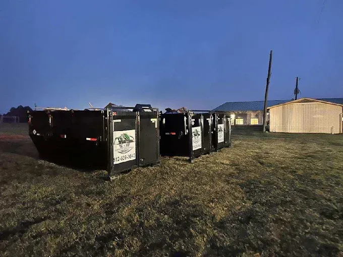 Roll off dumpsters staged on a property for a residential cleanout
