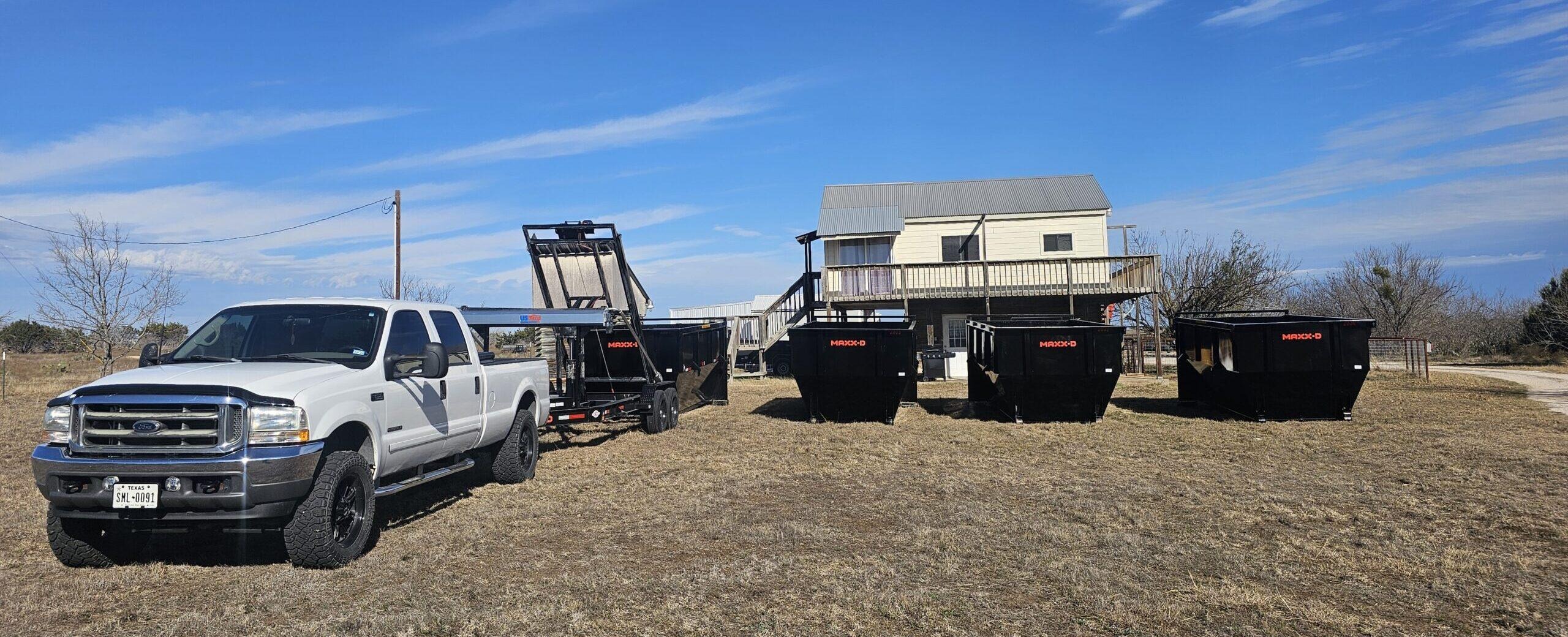 Truck and roll off dumpsters ready for a Central Texas construction site